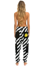 Cargar imagen en el visor de la galería, CAUTION SMILEY 2 EMBROIDERY CARGO COLOR BLOCK SWEATPANTS - BLACK // WHITE Sweatpants Aviator Nation