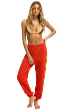 Cargar imagen en el visor de la galería, SMILEY SUNSET WOMENS SWEATPANTS - RED Women's Sweatpants Aviator Nation