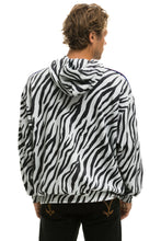 Carregar imagem no visualizador da galeria, CLASSIC RELAXED PULLOVER HOODIE WITH ZIPPER POCKETS - ZEBRA Hoodie Aviator Nation