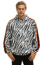 Carregar imagem no visualizador da galeria, CLASSIC RELAXED PULLOVER HOODIE WITH ZIPPER POCKETS - ZEBRA Hoodie Aviator Nation