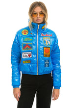 Load image into Gallery viewer, VINTAGE PATCH APRES PUFFER JACKET - BLUE CINA GLOSSY Women&#39;s Outerwear Aviator Nation
