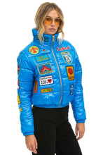 Load image into Gallery viewer, VINTAGE PATCH APRES PUFFER JACKET - BLUE CINA GLOSSY Women&#39;s Outerwear Aviator Nation