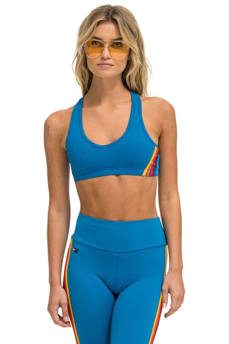 WOMEN'S 5 STRIPE V-CUT SPORTS BRA - CARRIBEAN Sports Bra Aviator Nation
