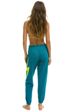 Cargar imagen en el visor de la galería, WOMEN&#39;S BOLT SWEATPANTS - TEAL // NEON YELLOW SALE Aviator Nation